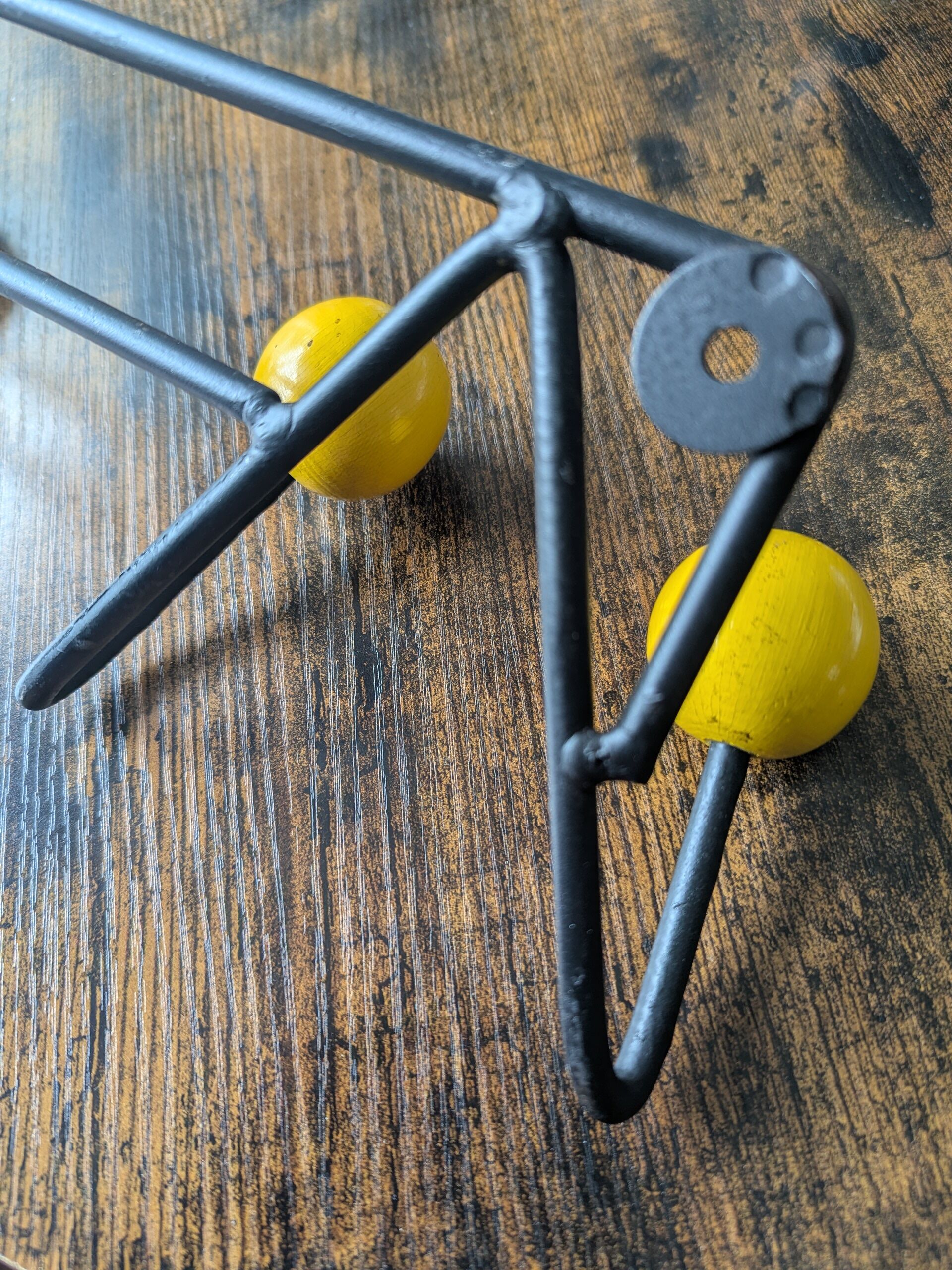 Vintage coat rack Roger Feraud with 4 yellow ball hooks.