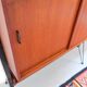 Vintage teak shelving system in 60s-70s style, retro style.