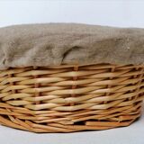 Braided rattan pan-maker bread basket covered with linen fabric
