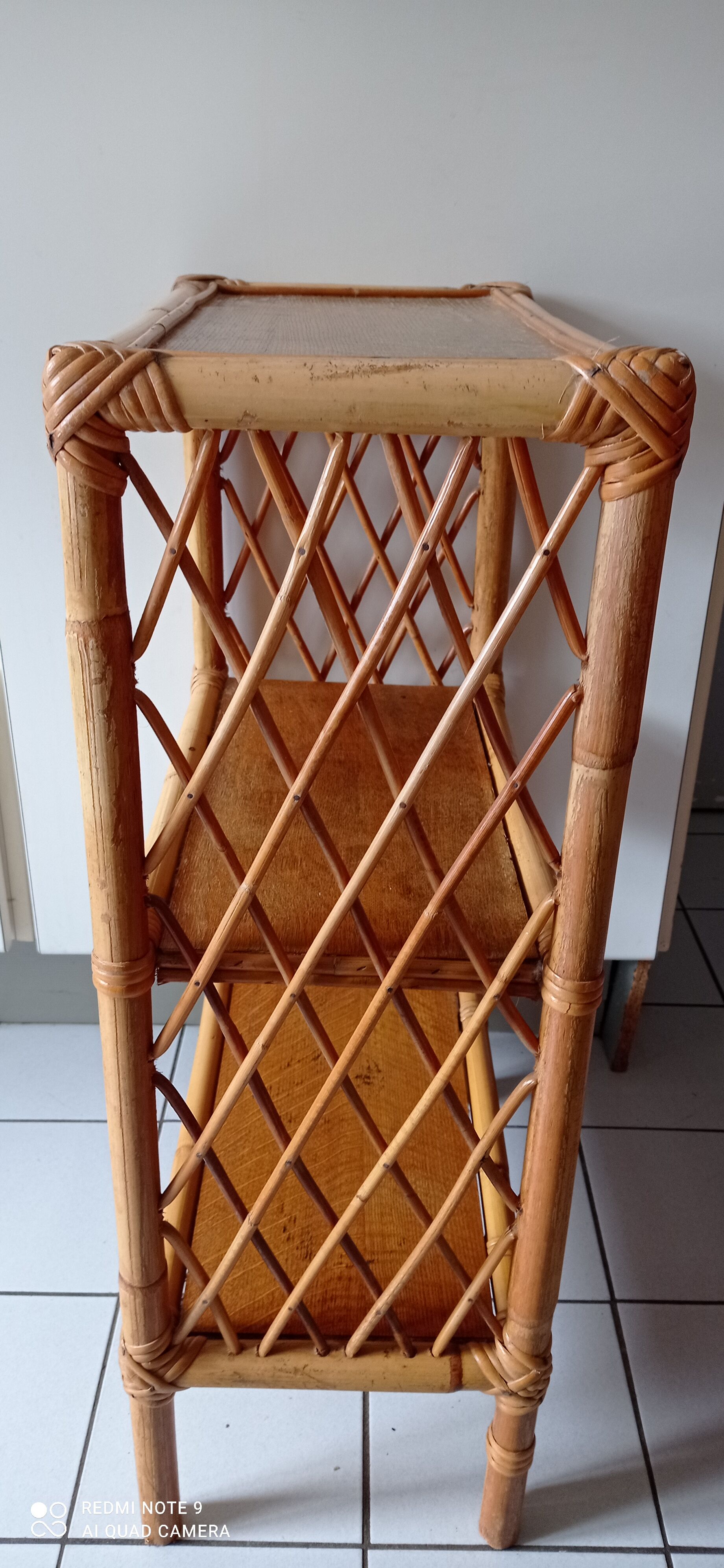 Old shelf on vintage rattan stands