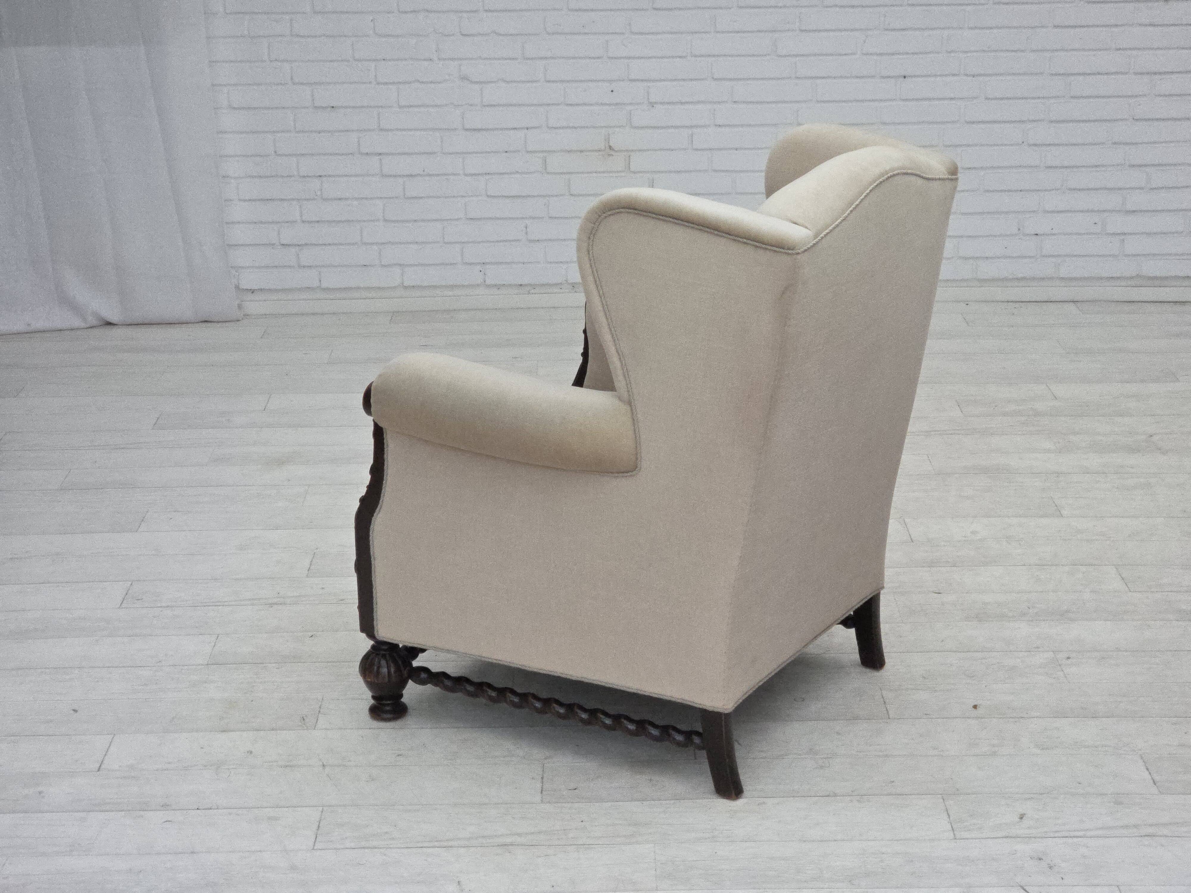 1960s, Danish wingback armchair, furniture velour, carved oak wood.