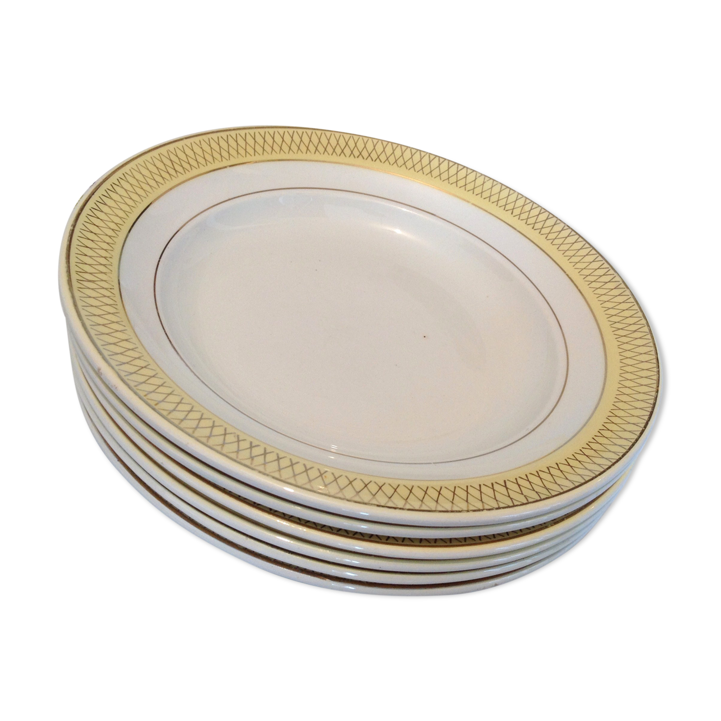 Six white hollow plates on board yellow Monaco 60