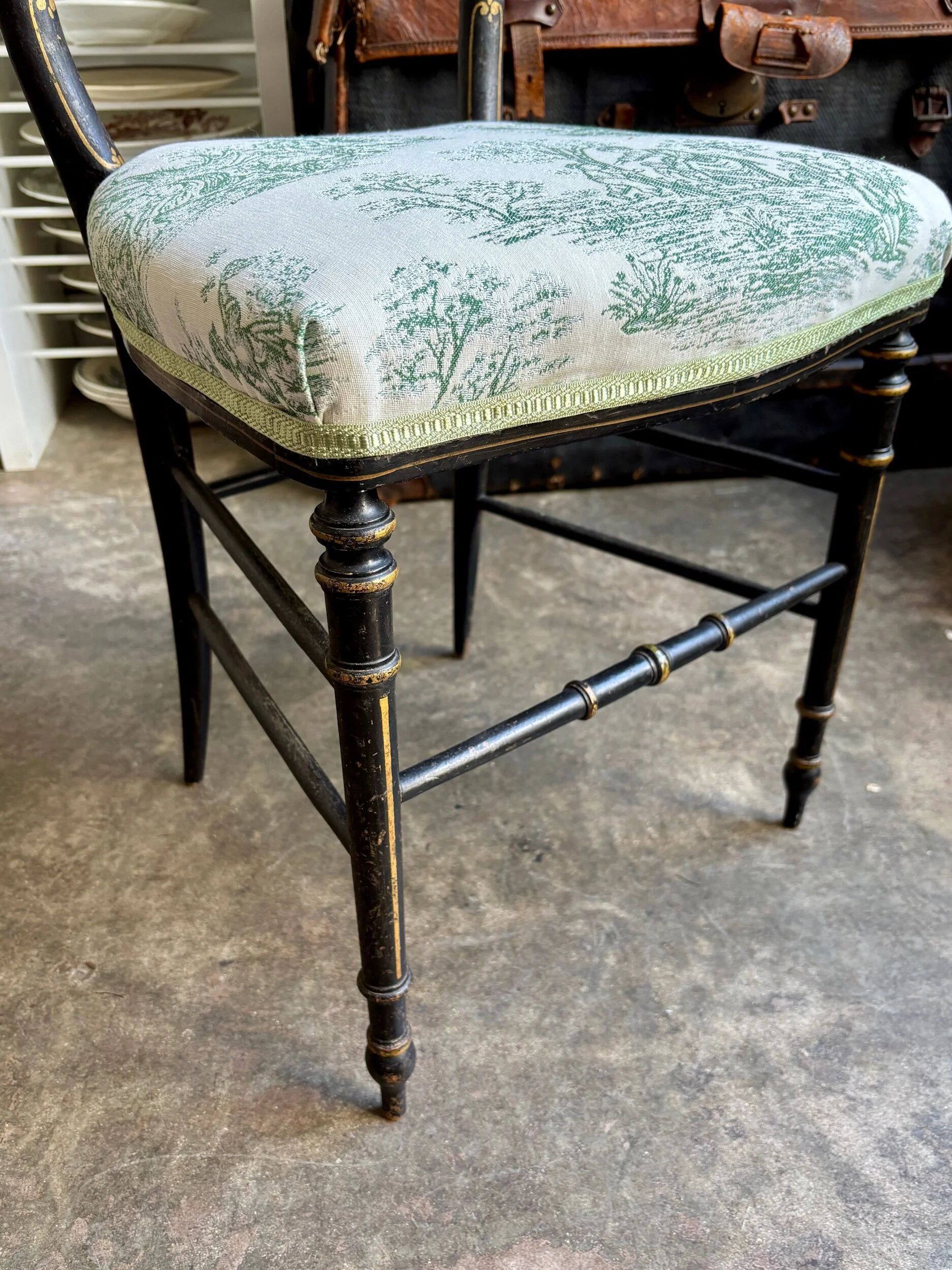 Napoleon III chair in blackened wood and green toile de Jouy.