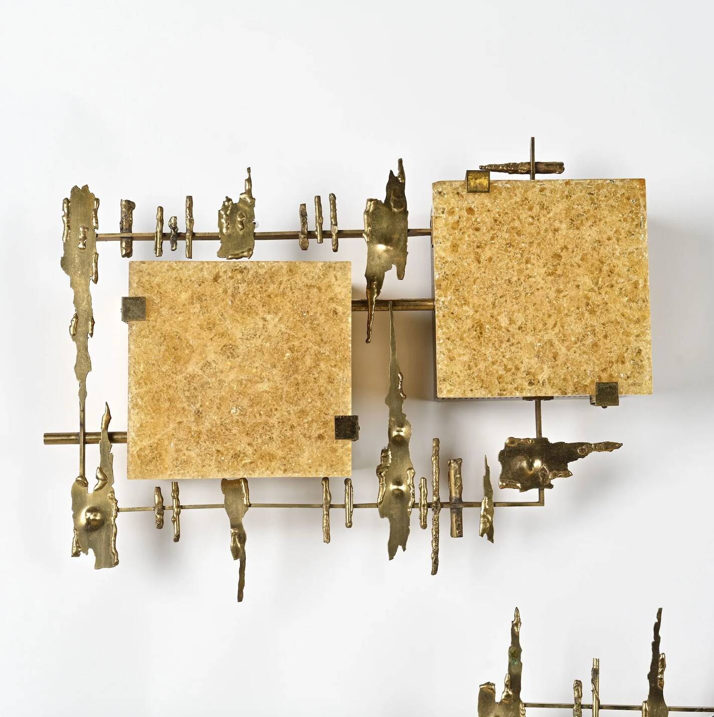 Pair of brutalist wall sconces in brass and fractal resin from the 1970s.
