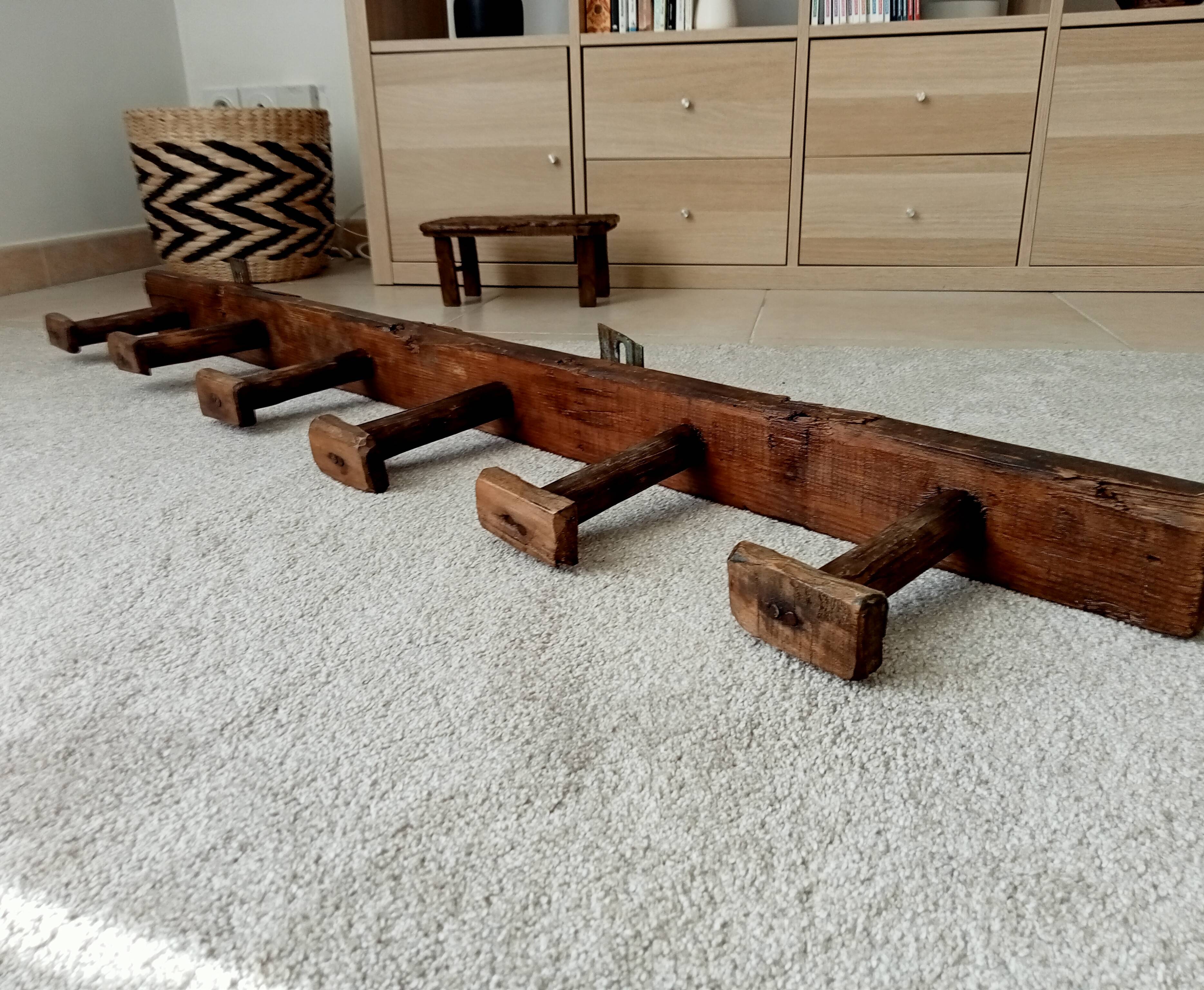 Old wall-mounted coat rack from a stable, folk art.