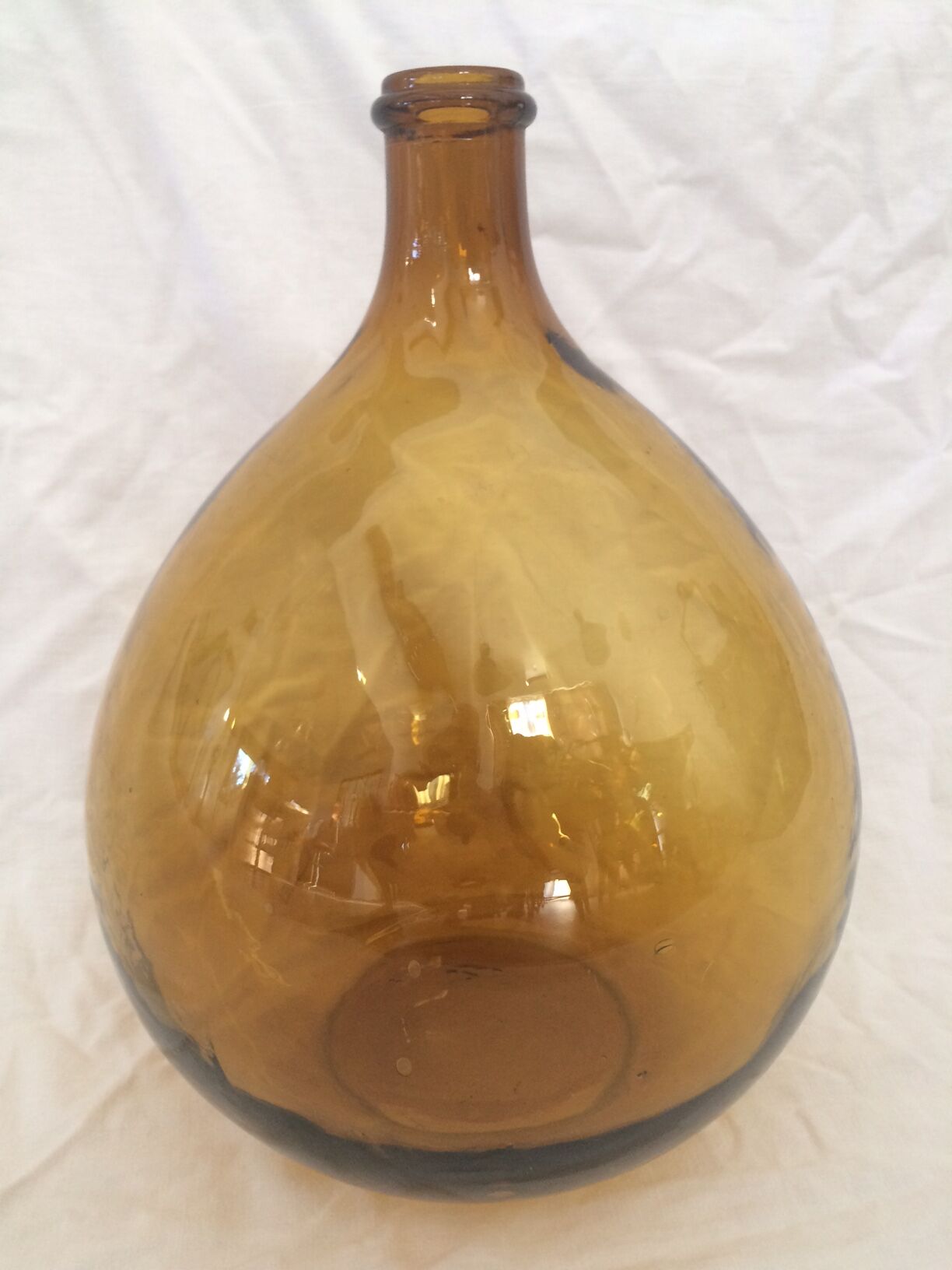Transparent amber demijohn of 10L