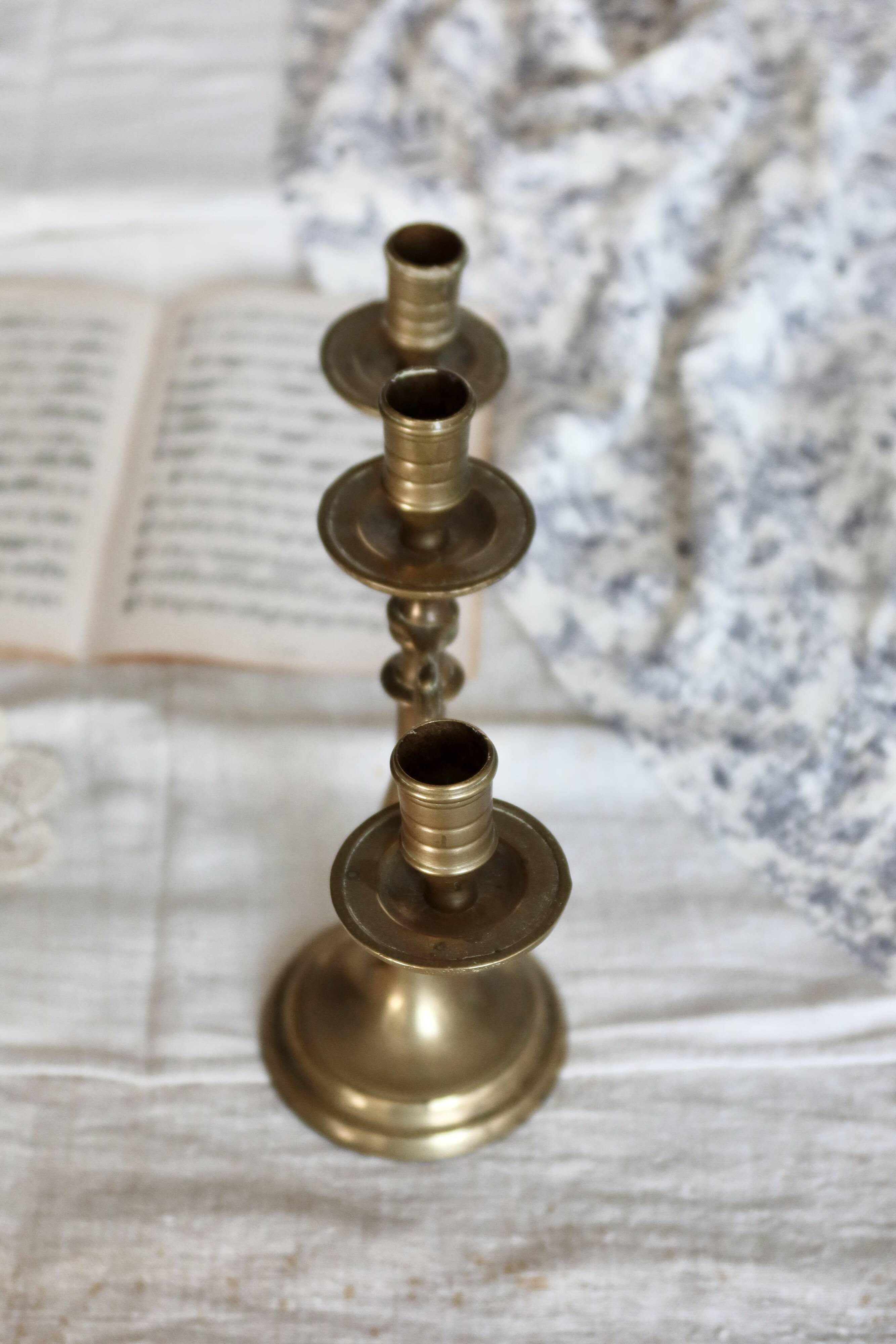 Antique 3-branch candelabra in patinated brass