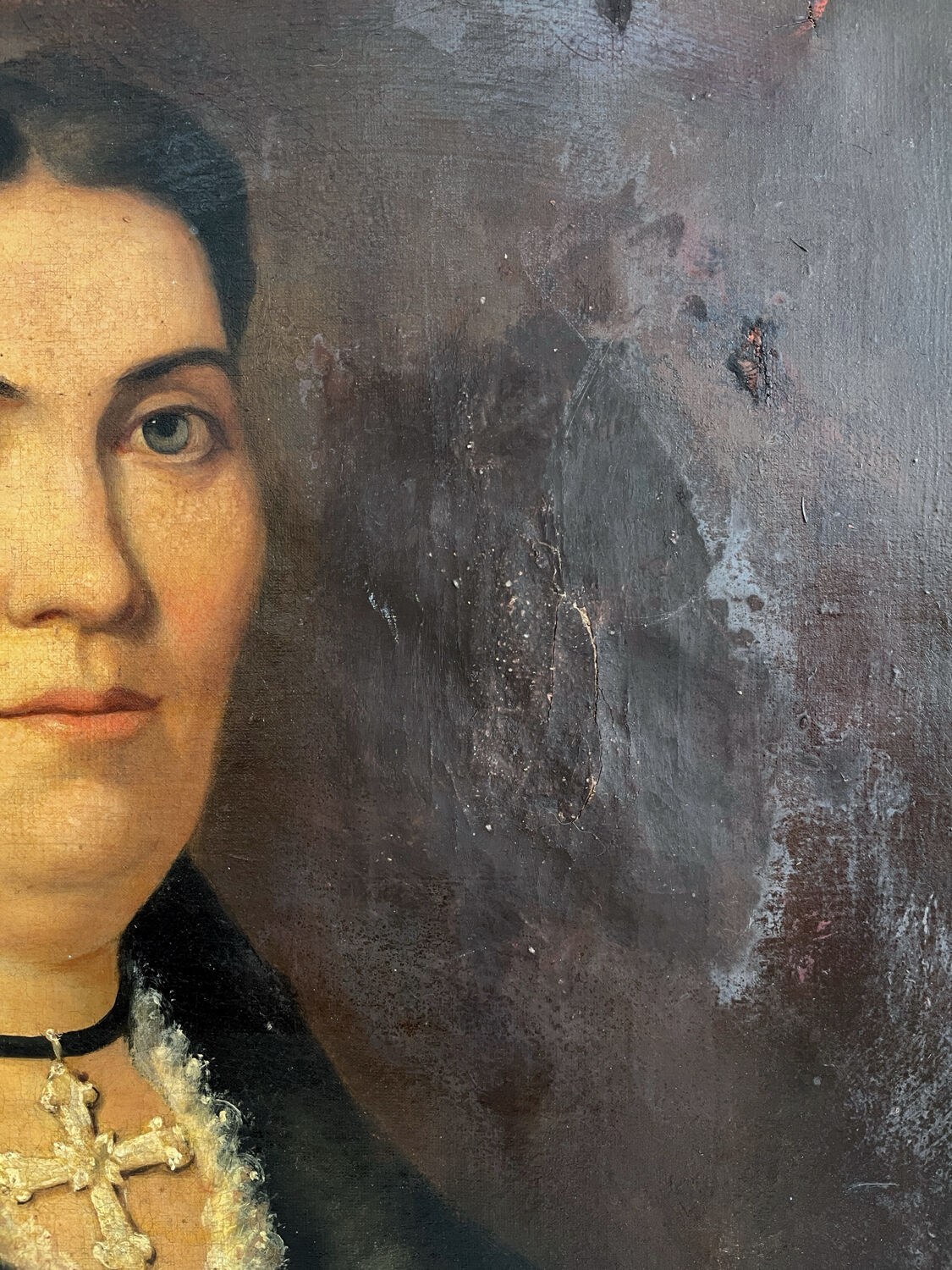 Old oil painting on canvas portrait of a woman with a red bow, late 19th century