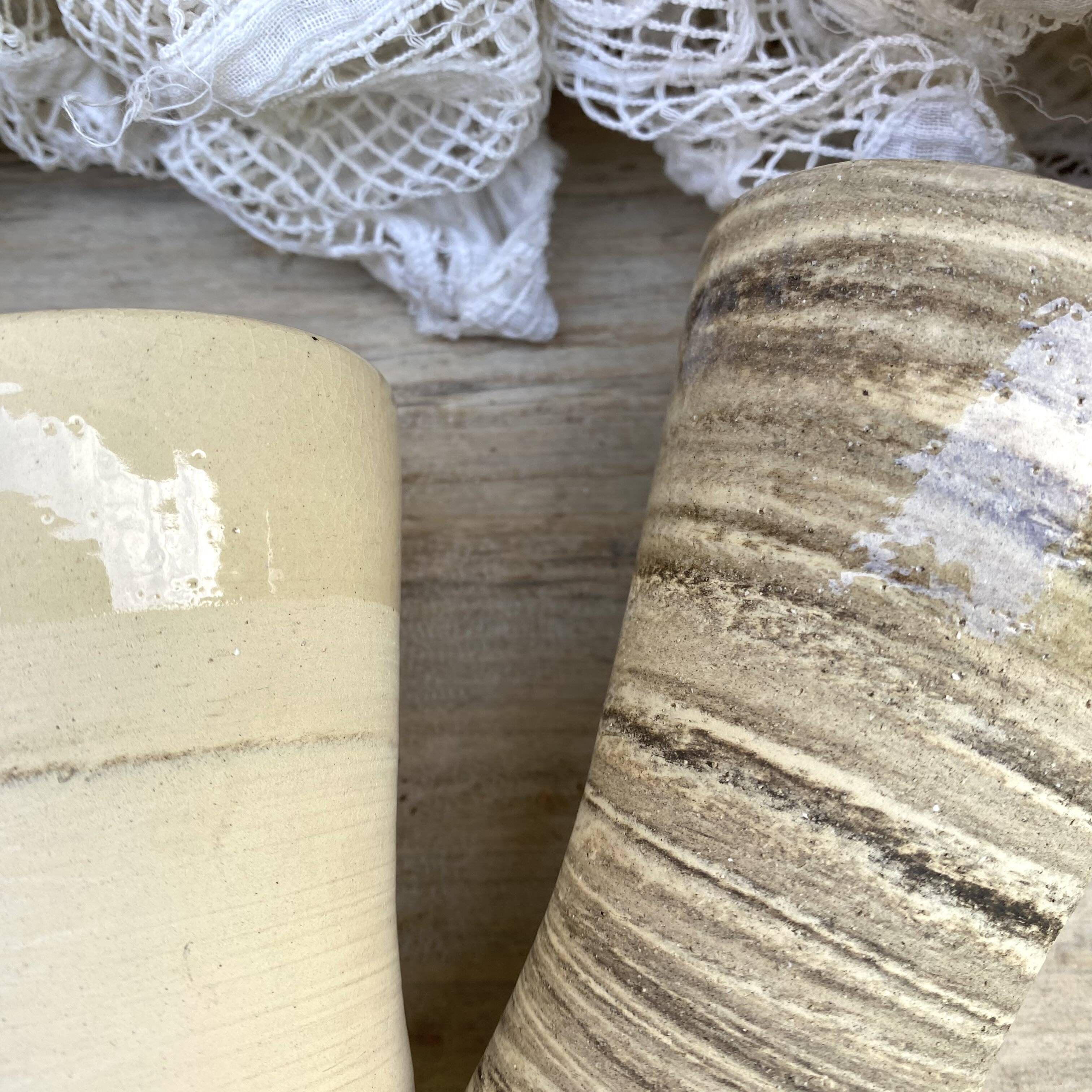 High ceramic cups made of mixed clay.
