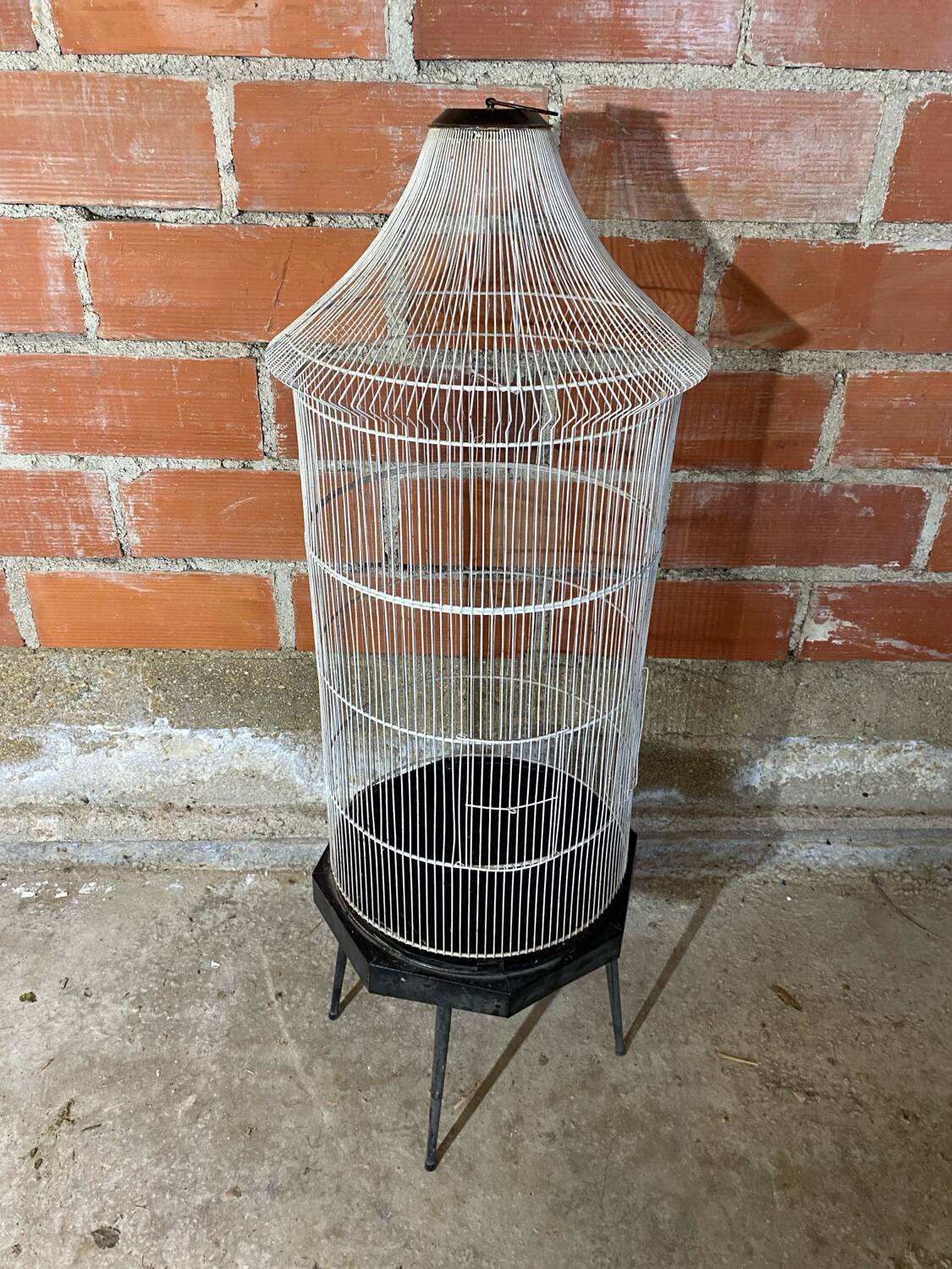 Antique black & white metal bird cage on vintage decorative legs