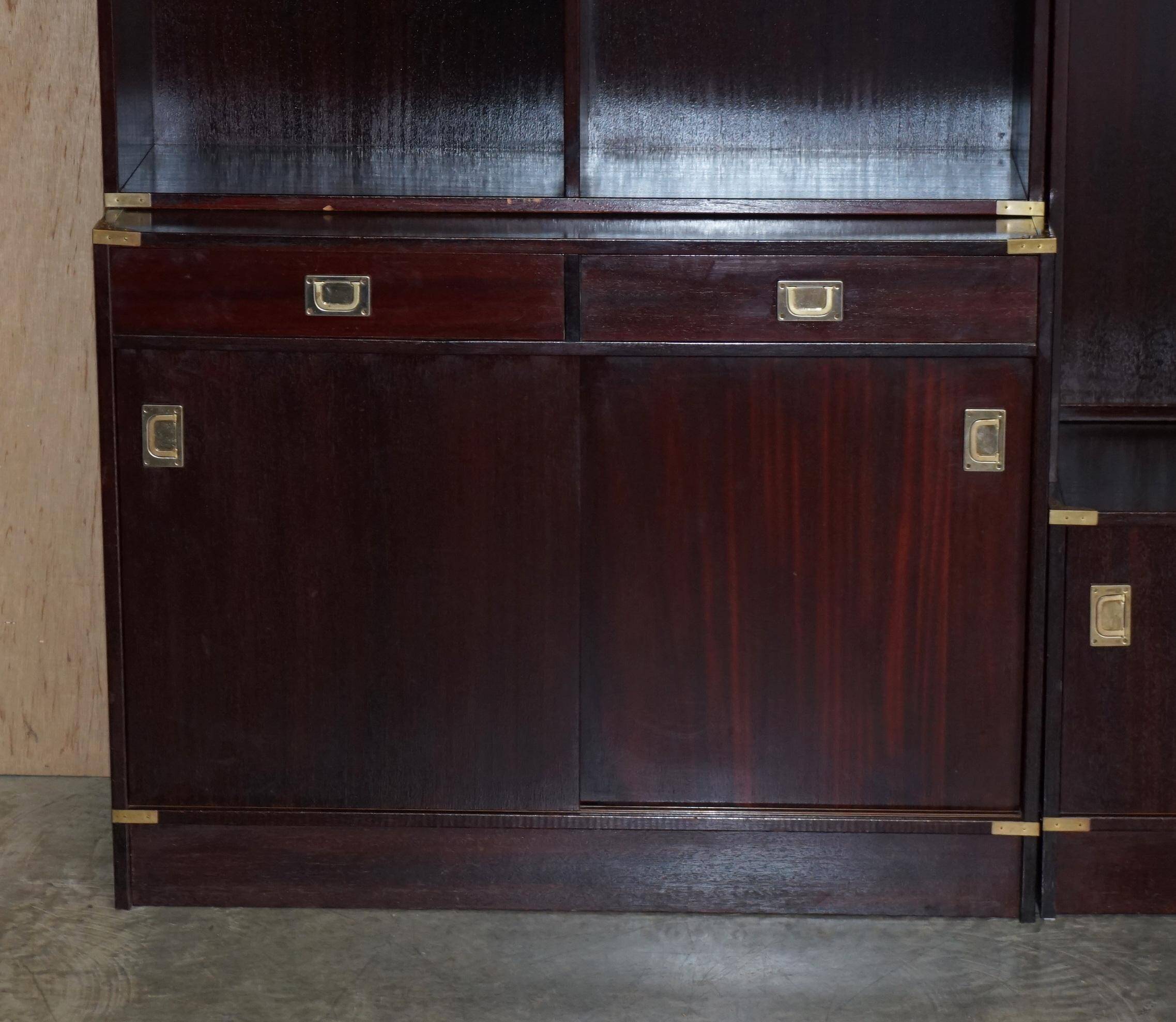 Three vintage style Military Campaign bookshelves, mahogany finish.