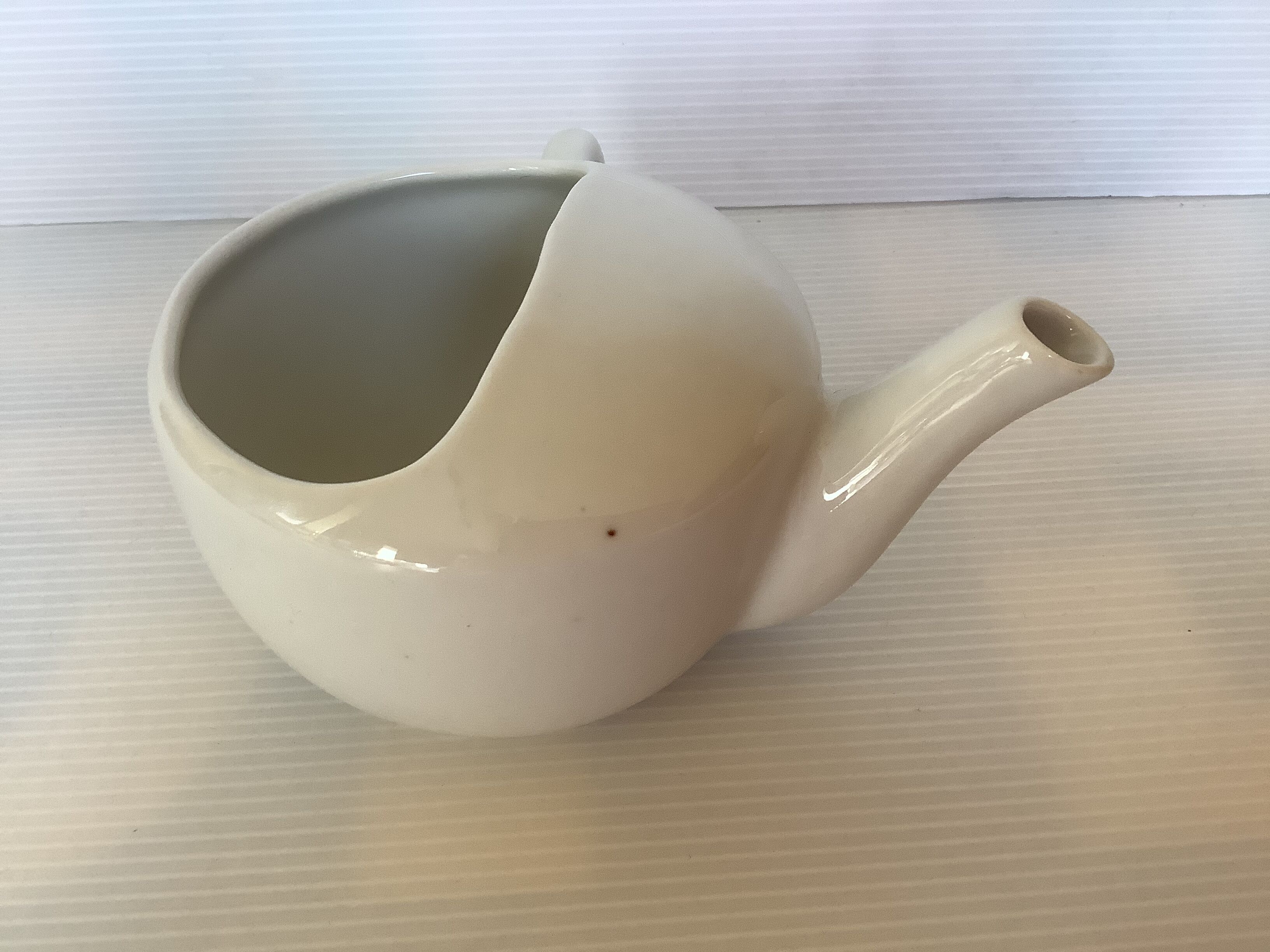 Old baby bottle sauceboat