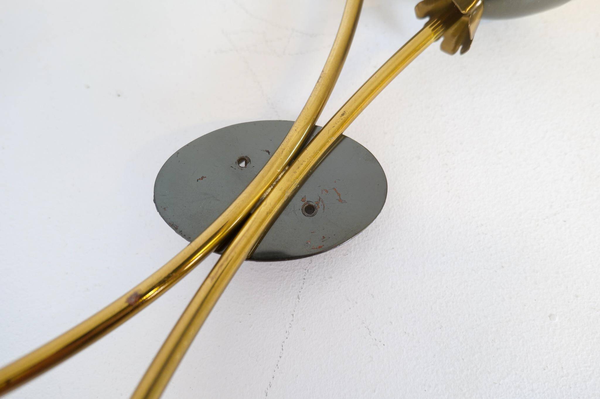 Mid-century pair of wall lamps in brass and opaline attributed to Asea Sweden, 1950s.