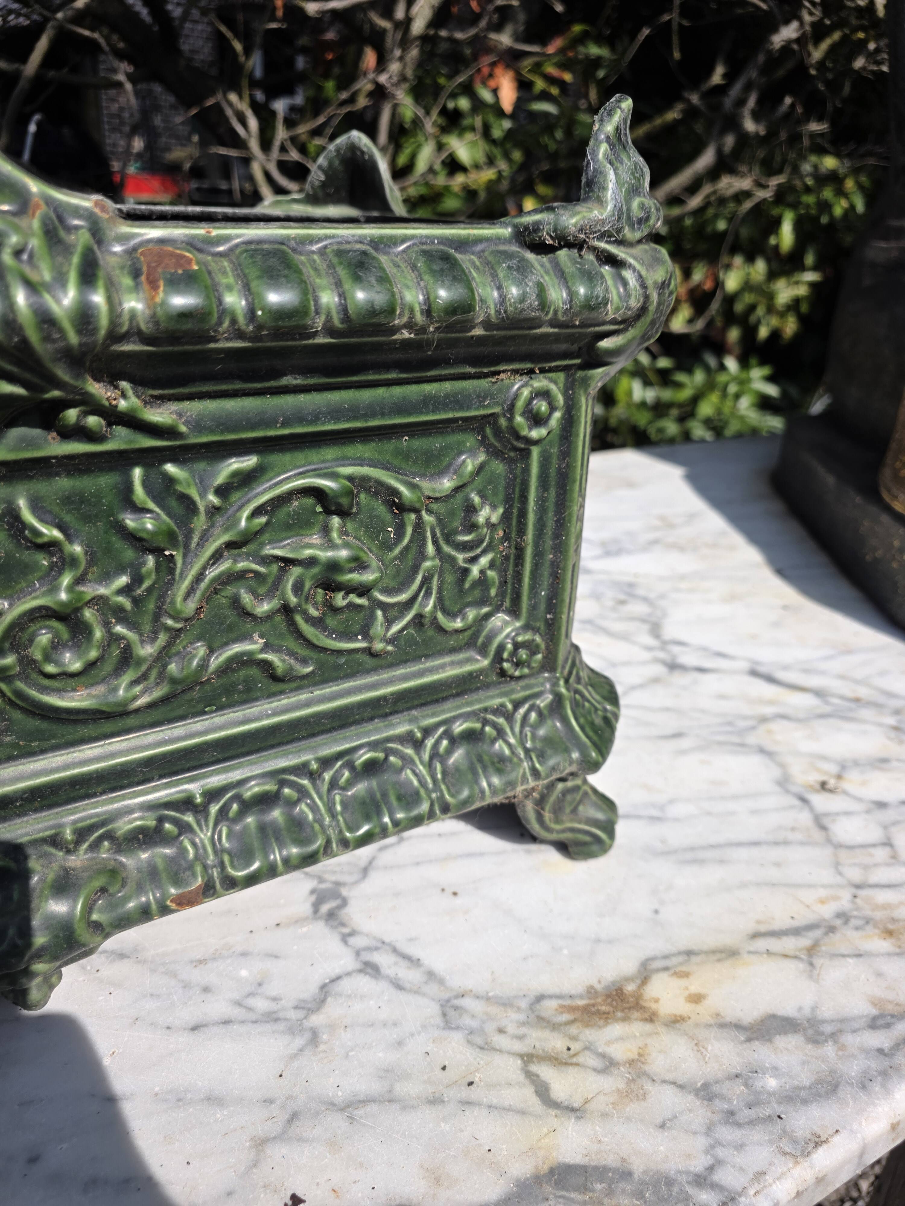 Antique enamelled cast iron planter in the Napoleon III style.