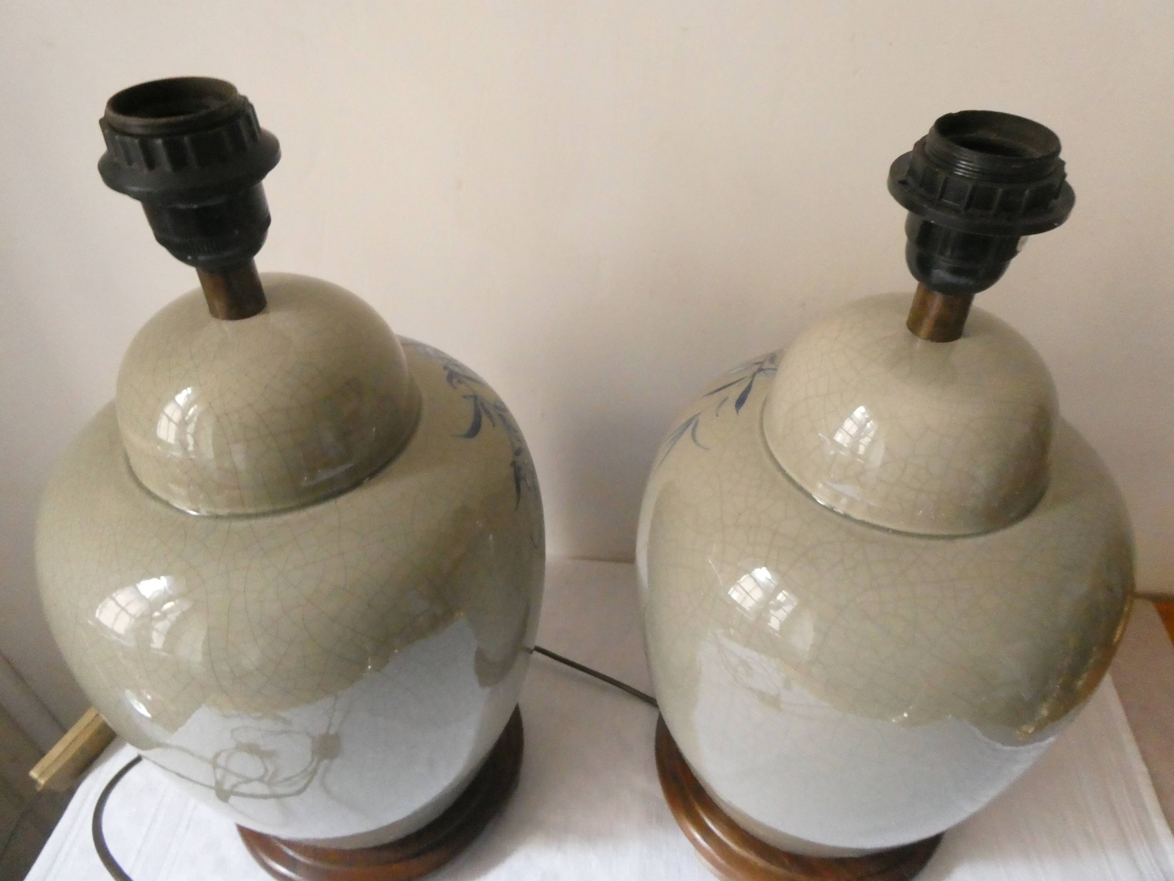 Pair of celadon crackle ceramic lamp bases decorated with flowers.
