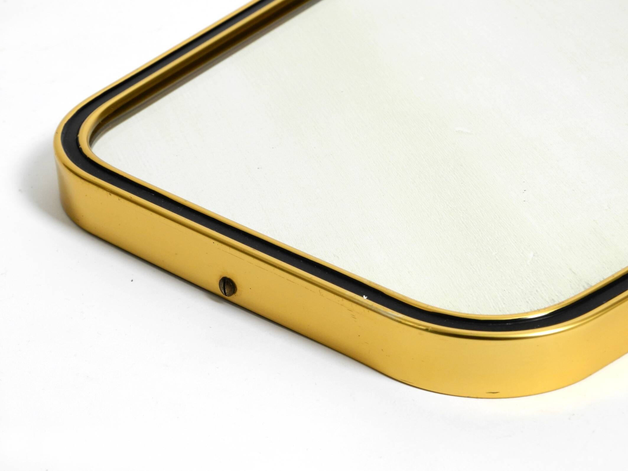 Beautiful small mid-century brass wall mirror with braided hanging strap