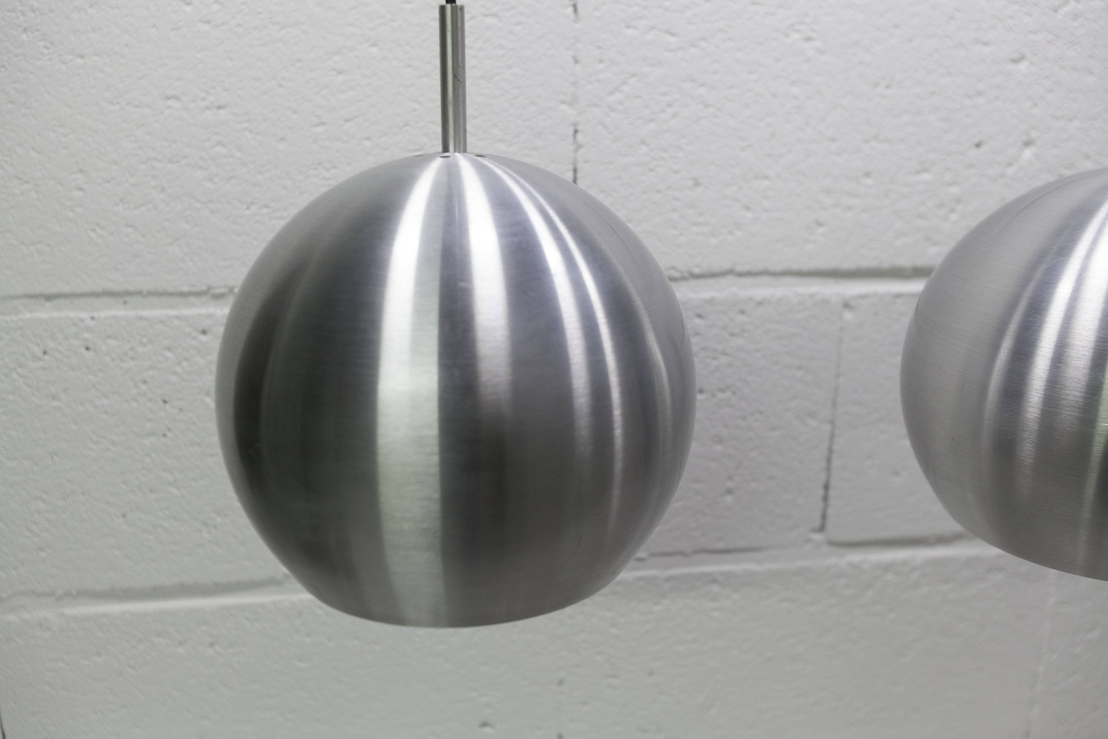 Pair of functional 70's aluminum ball pendants