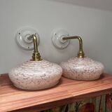 Pair of pink globe wall lights