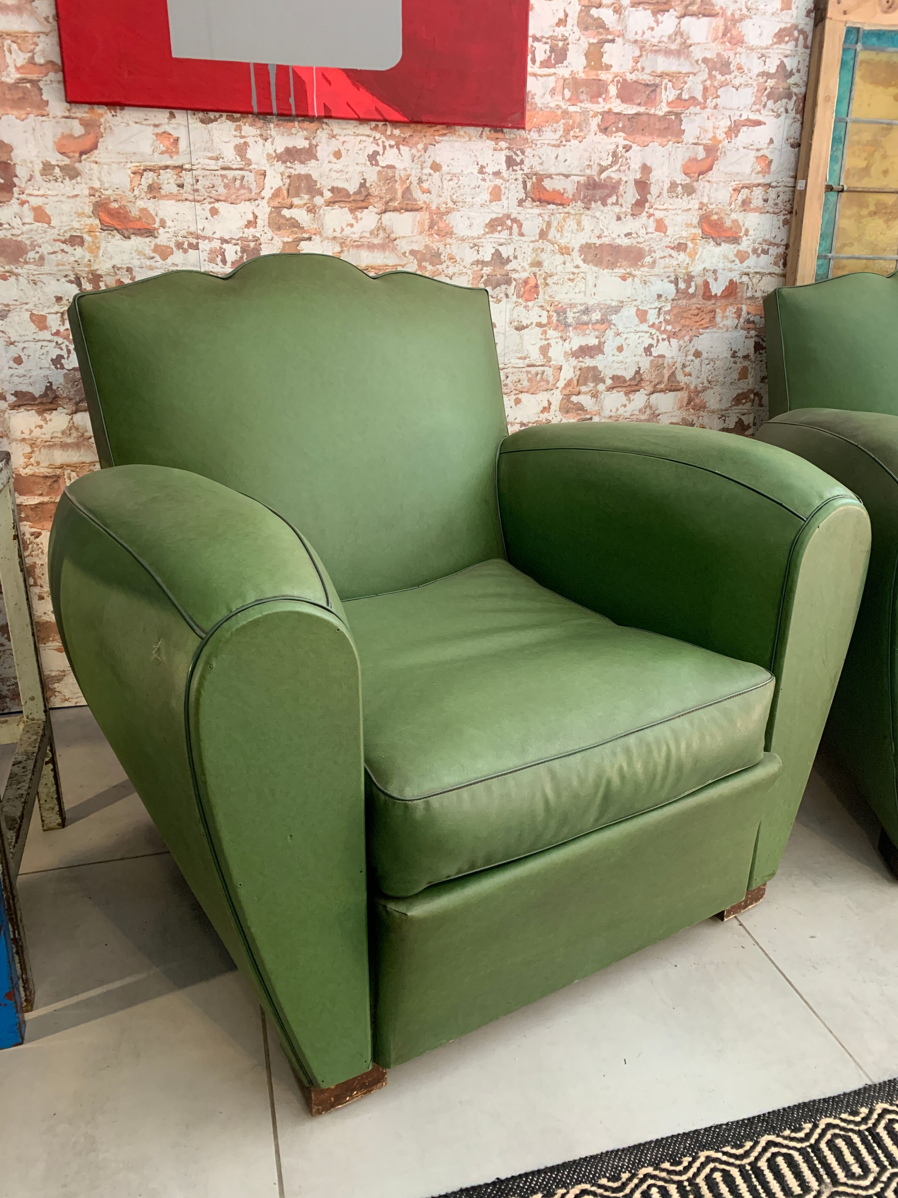 Pair of mustache club armcairs in green skai