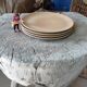 Set of four plates in sandstone