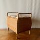 Large vintage rattan and wicker sewing basket with floral decor seat