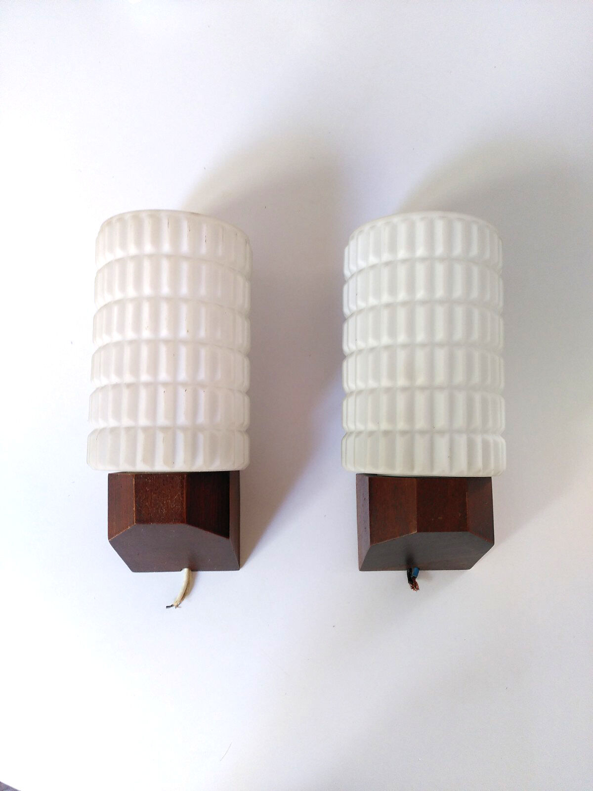 Opaline and teak sconces
