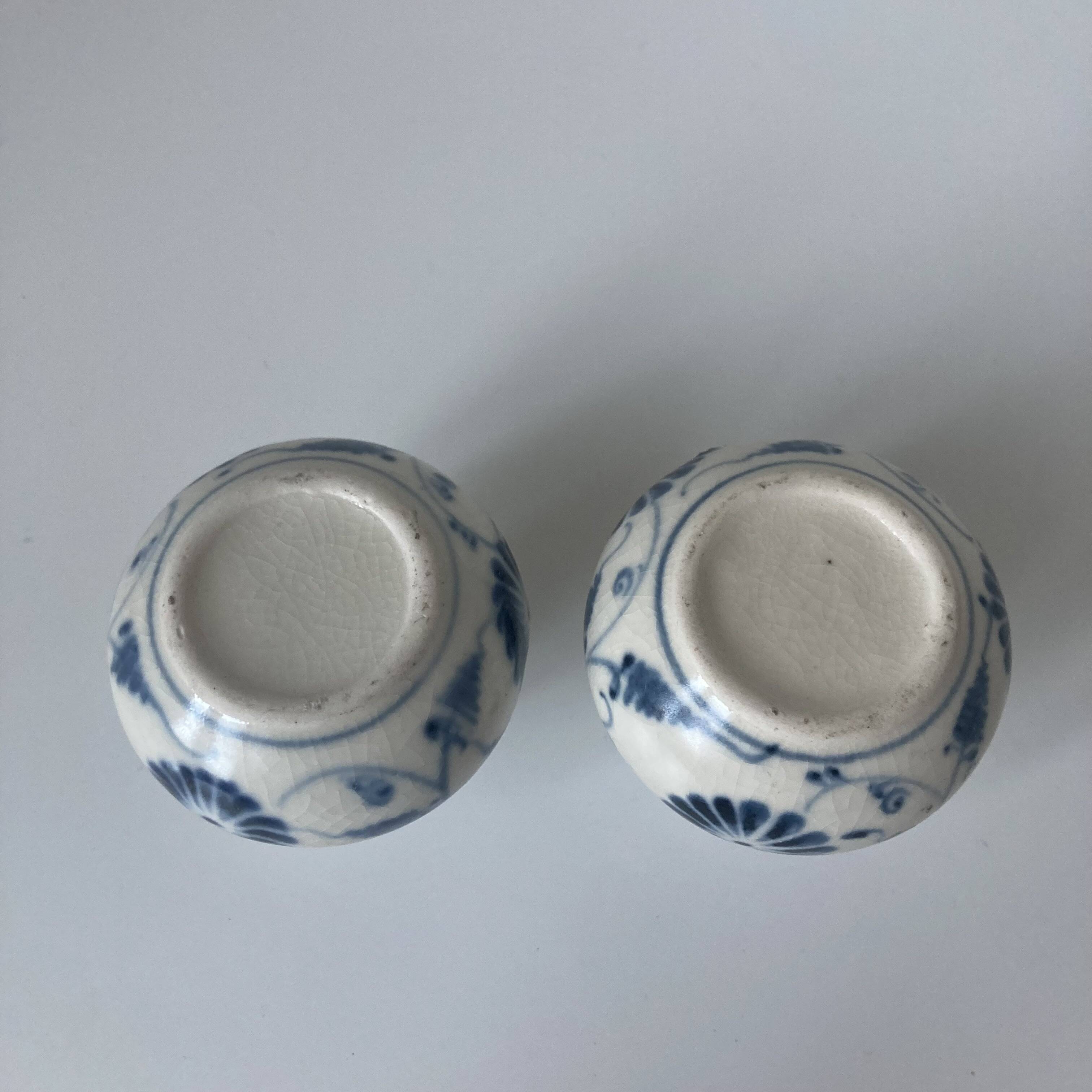 Pair of miniature blue and white Vietnamese ceramic vases with floral decoration.