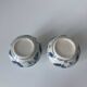 Pair of miniature blue and white Vietnamese ceramic vases with floral decoration.