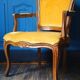 Velvet cabriolet armchair with decorative copper studs.