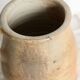 Old rustic stoneware jar with handle