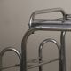 Vintage 1970s rolling dessert trolley in chrome metal and mirrored glass.