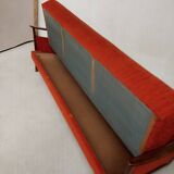 Vintage orange convertible sofa