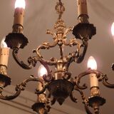 Chandelier in gilded with six arms chiseled bronze.