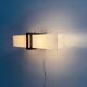 Simple white plexiglass wall light with a black metal frame, 1970s, Germany.