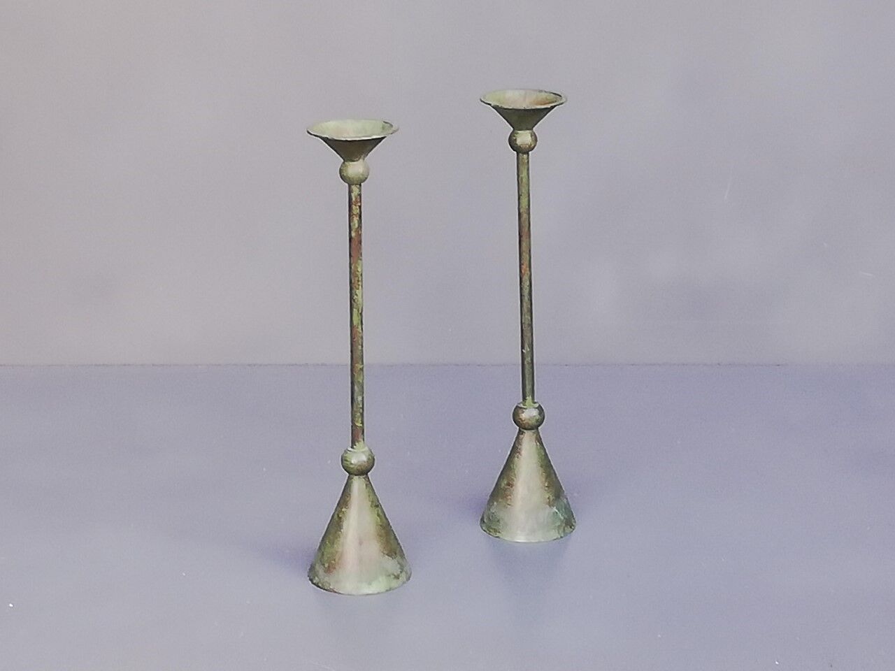 Pair of bronze patina metal candlesticks