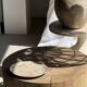Suspension or rattan lampshade in the shape of a woven bulb.