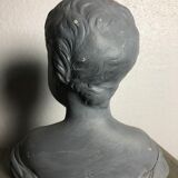 Child bust in grey patinated plaster