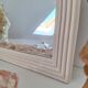Beige bevelled and moulded mirror