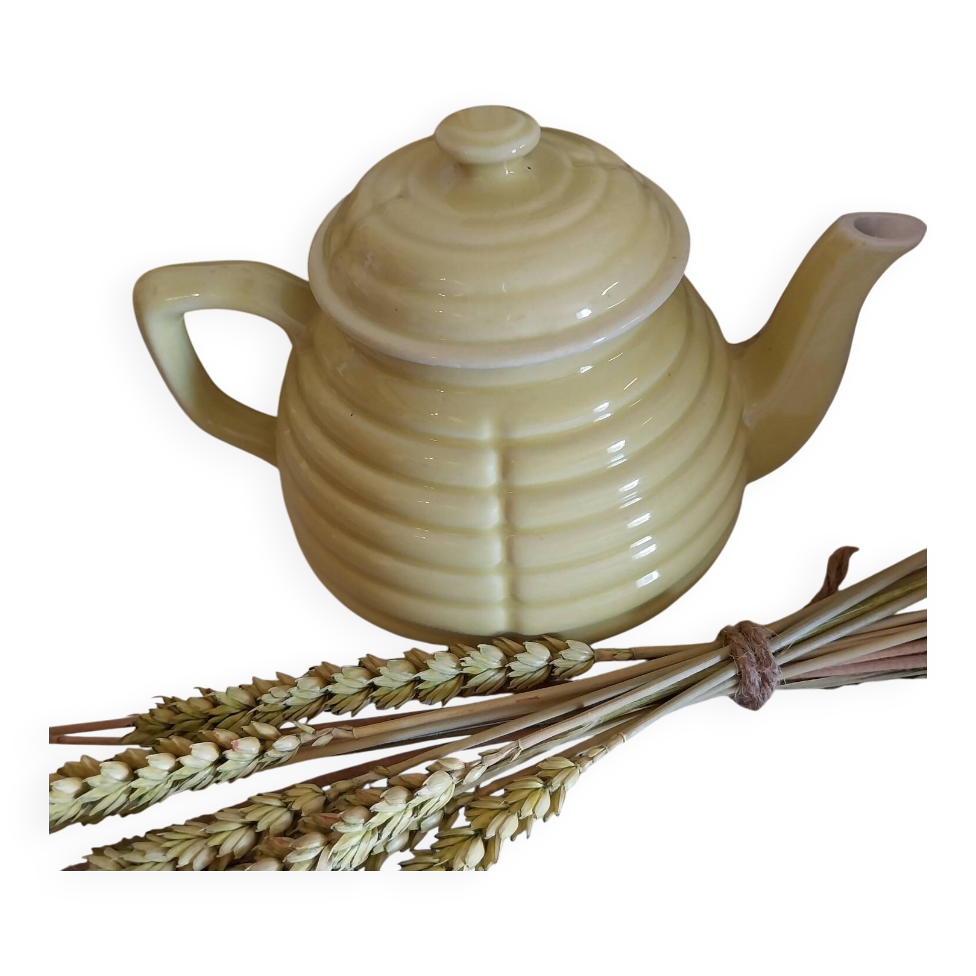 Old yellow earthenware teapot