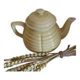 Old yellow earthenware teapot