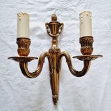 French Empire-style wall sconce or chandelier in bronze with an antique gold patina.