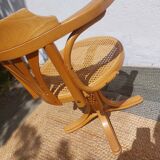 swivel armchair in wood and cane