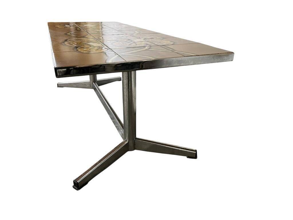 Vintage ceramic coffee table with a chrome frame.