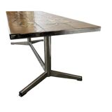 Vintage ceramic coffee table with a chrome frame.