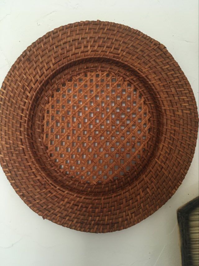 Wall composition of 9 wicker baskets and trays.