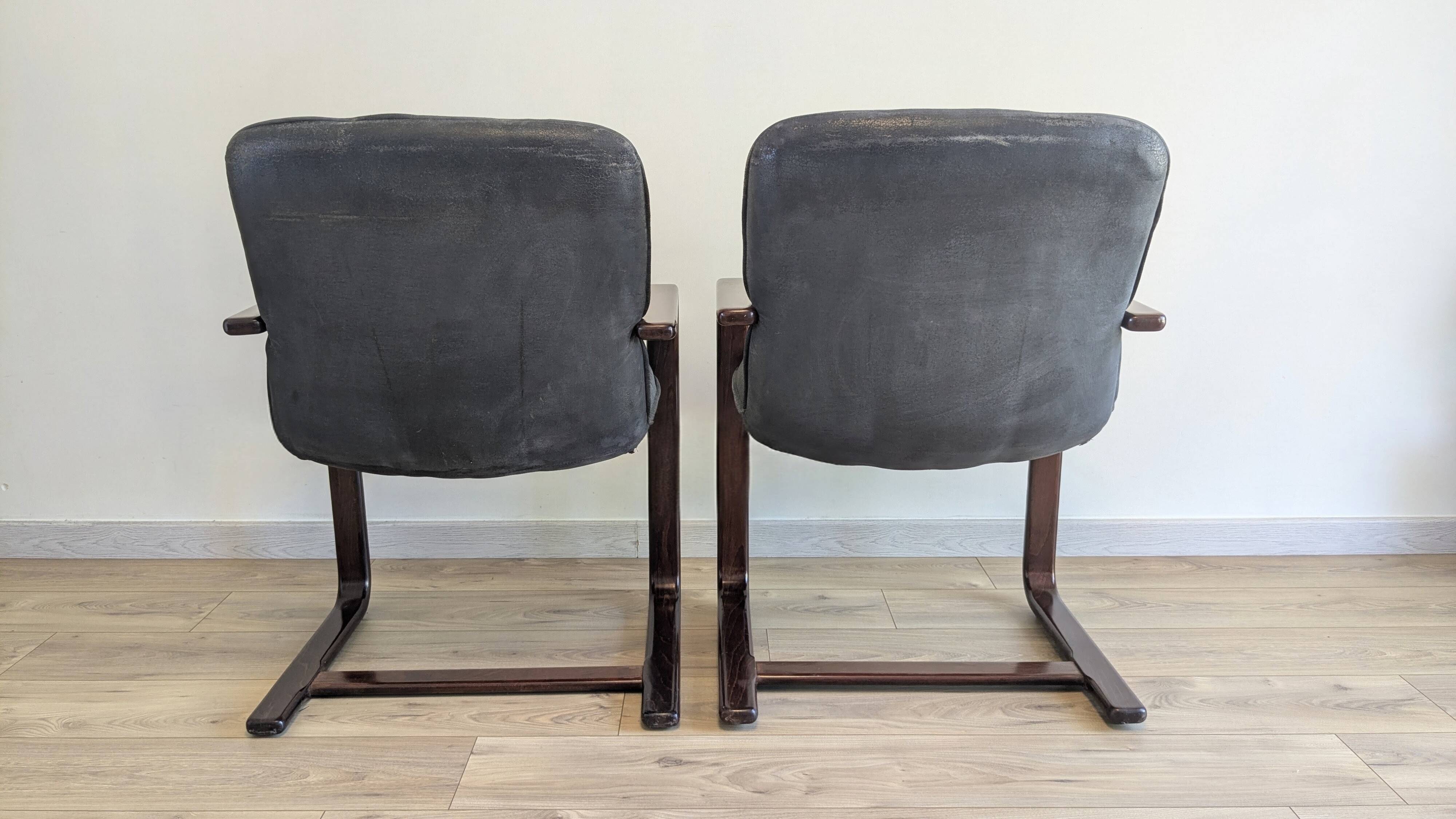 Pair of vintage cantilever armchairs in rosewood veneer.
