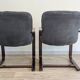 Pair of vintage cantilever armchairs in rosewood veneer.