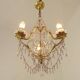 French gilt bronze three-light cage chandelier with pink and clear beaded swags.