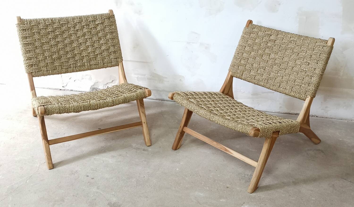 Pair of low armchairs in wood and woven rattan