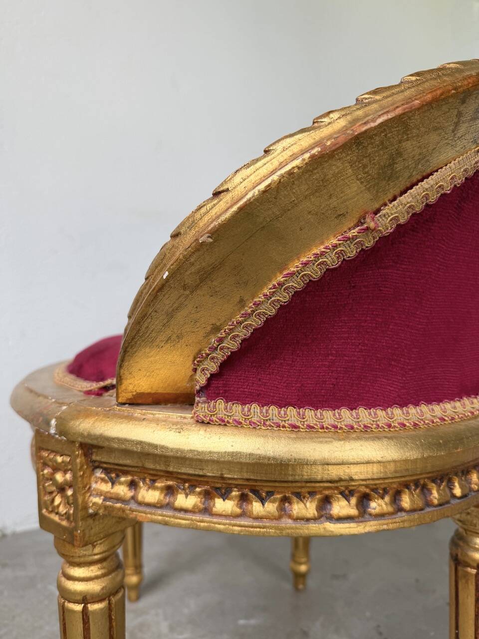 Louis XVI gilt wood and red velvet armchair